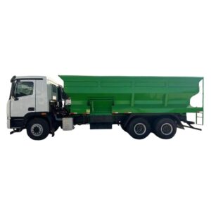 Jummos feed spreader truck with green high-sided body for livestock feed distribution